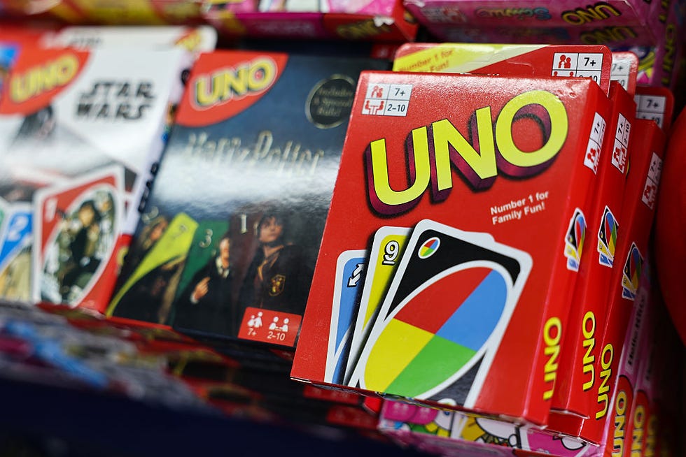 colorful uno card game packaging in a stock rack colorful uno card game packaging in a stock rack