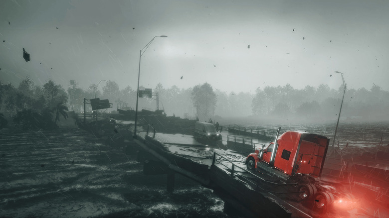 A semi truck drives at a tornado in the 