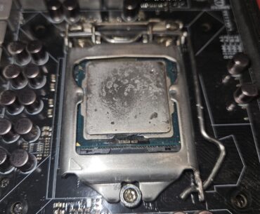 Gunk on lga1155 cpu. Possible damage from LM?