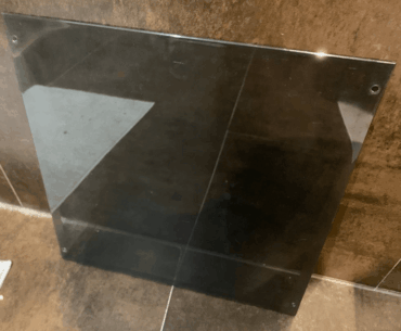 I've put the side panel of my PC to my tiled floor and it didn't shatter because it's plastic