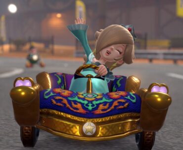 Rosalina waves while driving a kart.