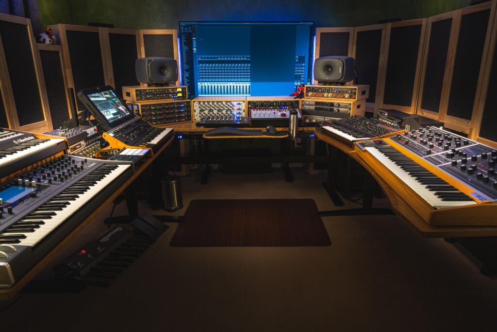 A PC for gaming, a Mac for music and 5 sit stand desks. Audio and video, Analog and digital, all living in one big Battlestation.