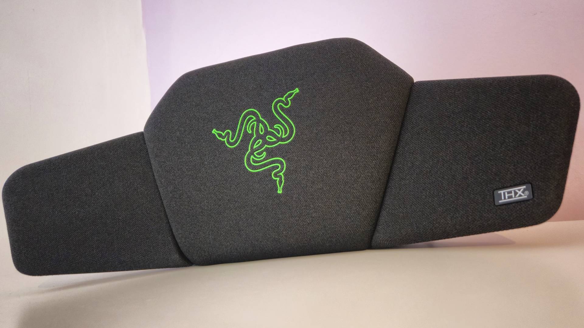 The Razer Clio made me fall in love with my gaming chair, but I wouldn’t run out and buy one Photo by Rosalie Newcombe of the Razer Clio wireless speaker head cushion sitting on a white desk.