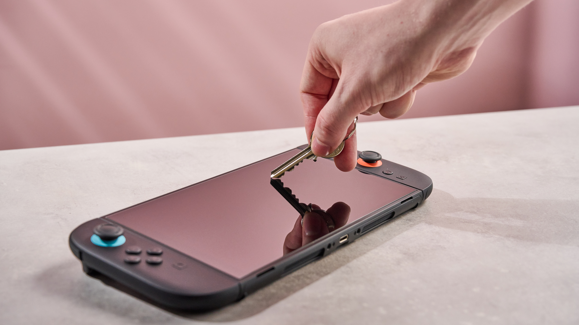 Do you really need a screen protector for your Nintendo Switch 2? I tested multiple models to find out Pushing key against the DBrand Prism 2.0 for Nintendo Switch 2