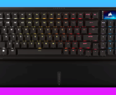 The Corsair Vanguard Pro 96 wired keyboard floats in a pink-blue gradient void.