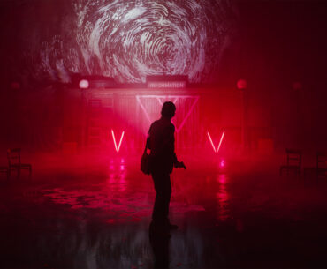 Alan Wake 2 screenshot &ndash; silhouetted figure on a red lit backdrop
