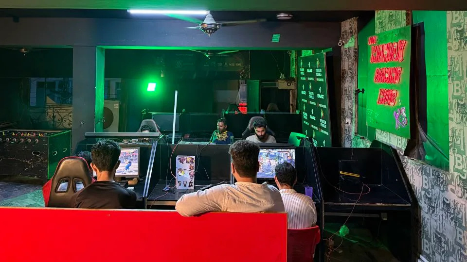 Gamers practice at the Maniax arcade. - Javed Iqbal/CNN