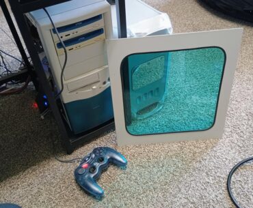 Case-modded a translucent blue/teal window in my Win98 gaming PC!