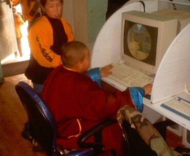 A Young Mongolian Buddhist monk playing Counter Strike 1.6 in the 2000s
