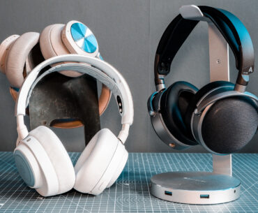 Two pairs of headphones. One, a SteelSeries set with ANC; the other, an Audeze set with great passive sound isolation.