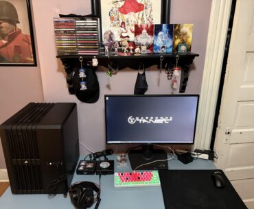 My setup. My room is very small so the shelf above my computer is where I keep my figurines, accessories, cd’s and whatnot.