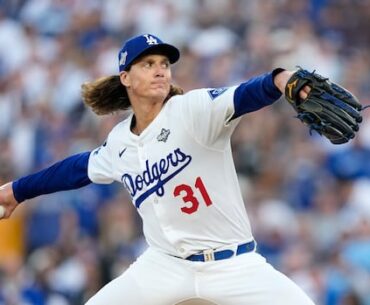 A baseball player throws a pitch.