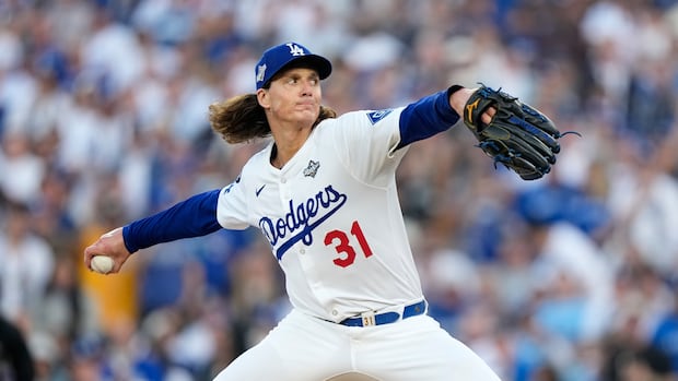 Toronto Blue Jays face Los Angeles Dodgers for Game 3 A baseball player throws a pitch.