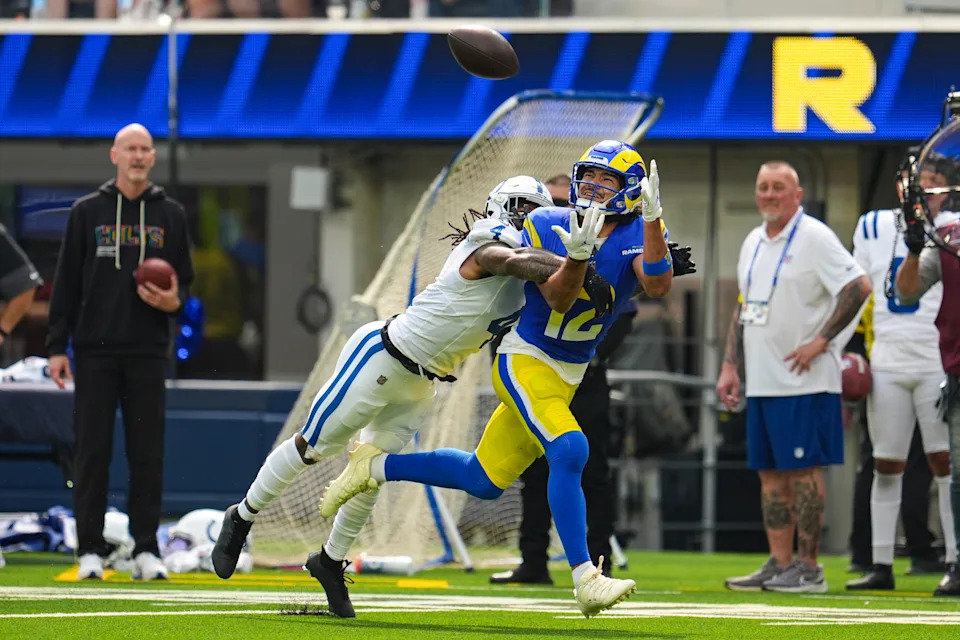 Los Angeles Rams wide receiver Puka Nacua (12) makes a catch in front of Indianapolis Colts cornerback Xavien Howard (4) during the first hall of an NFL football game Sunday, Sept. 28, 2025, in Inglewood, Calif. (AP Photo/Marcio Jose Sanchez)