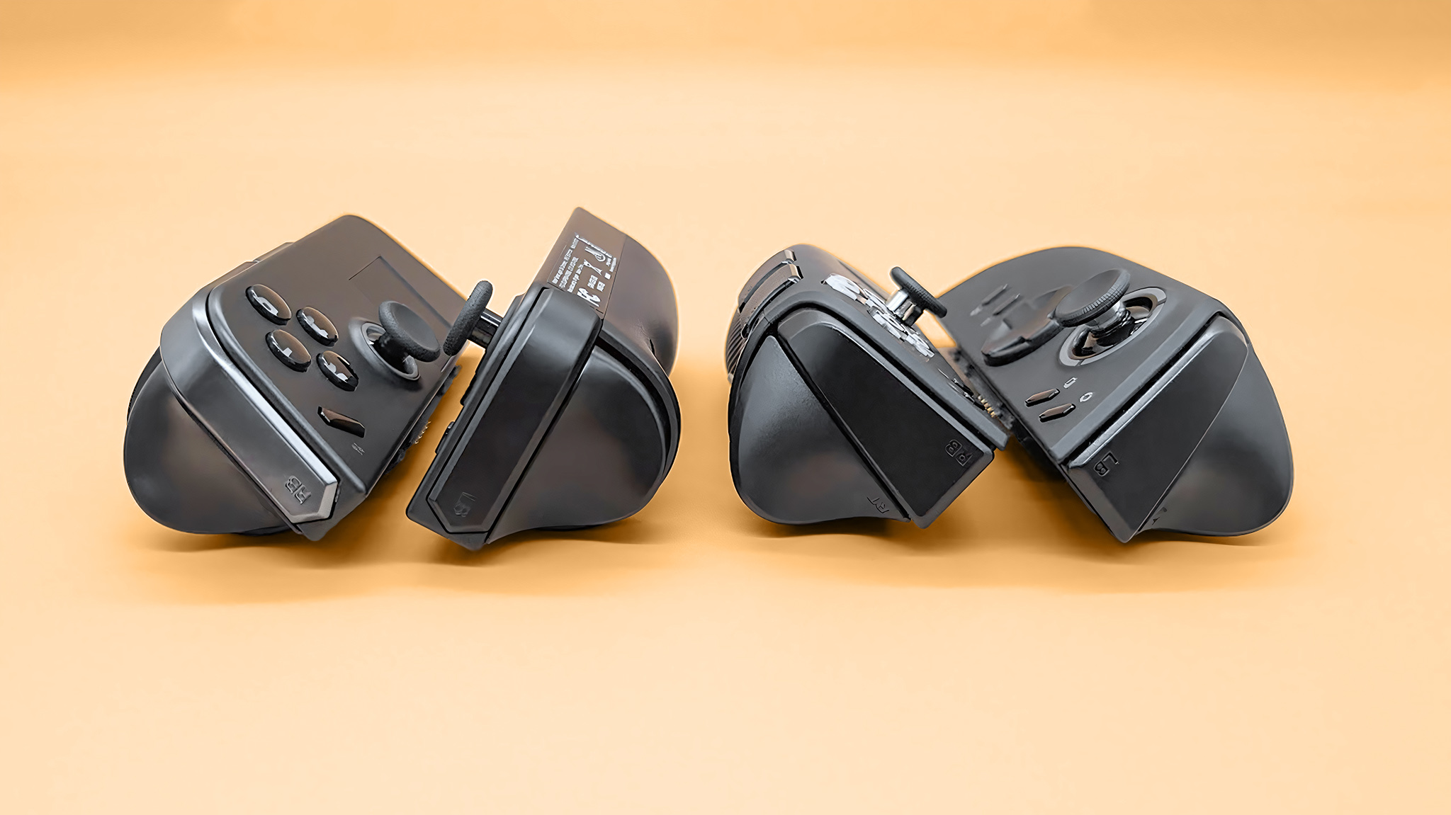 The tops of the Lenovo Legion Go 2 and original Legion Go controllers with a focus on the bumpers. 