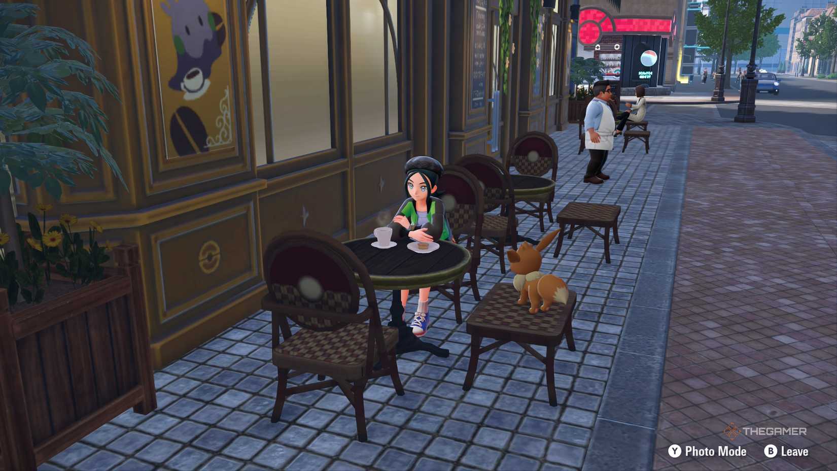 A player with an Eevee at a cafe in Pokemon Legends Z-A.