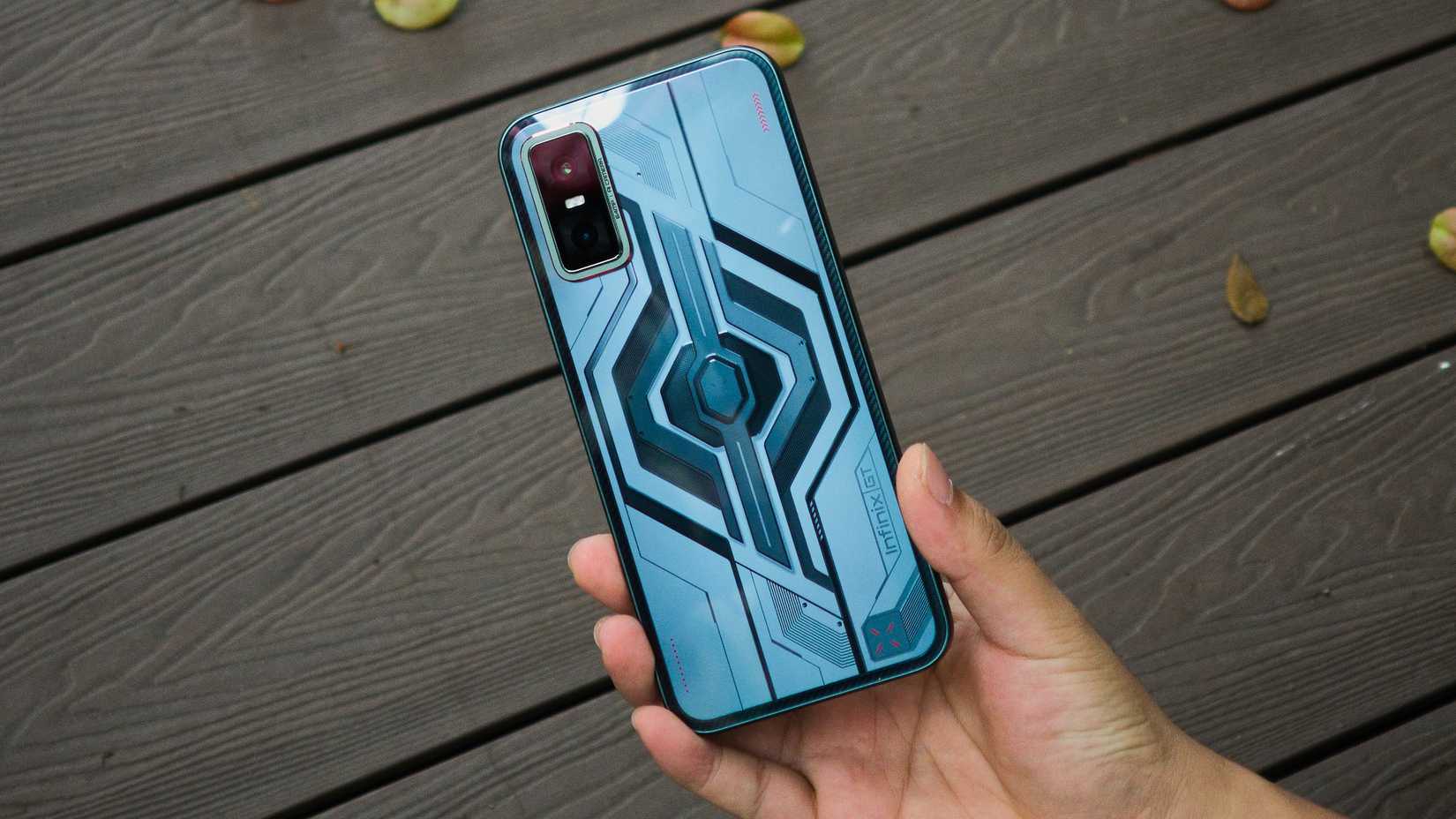 Person holding an Infinix GT 30 smartphone