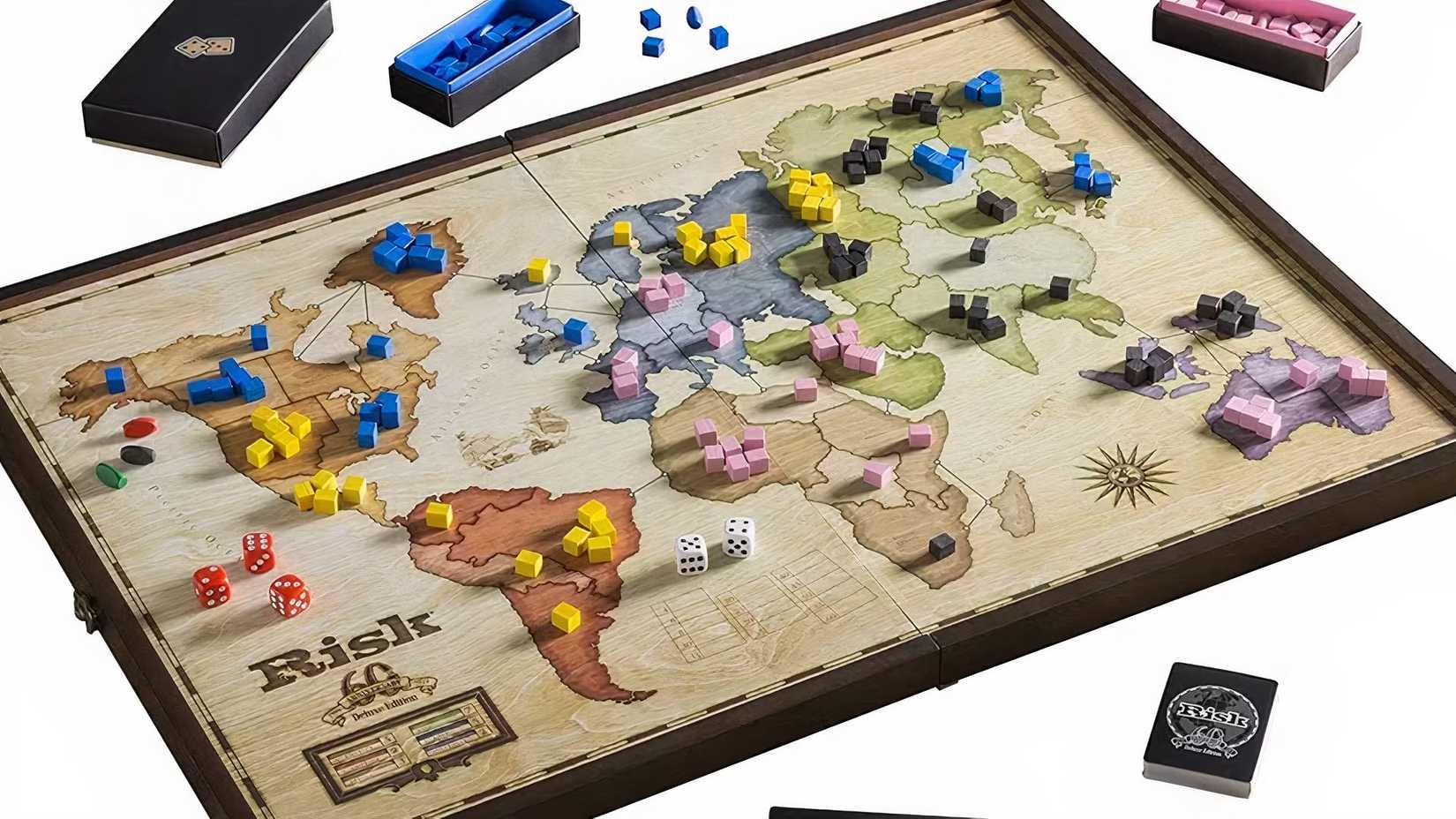 Risk board game with several armies set up on it.
