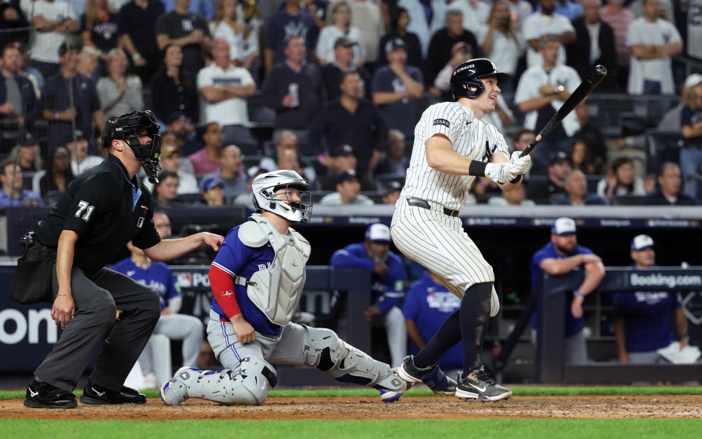 New York Yankees first baseman Ben Rice hitting a sacrifice fly.