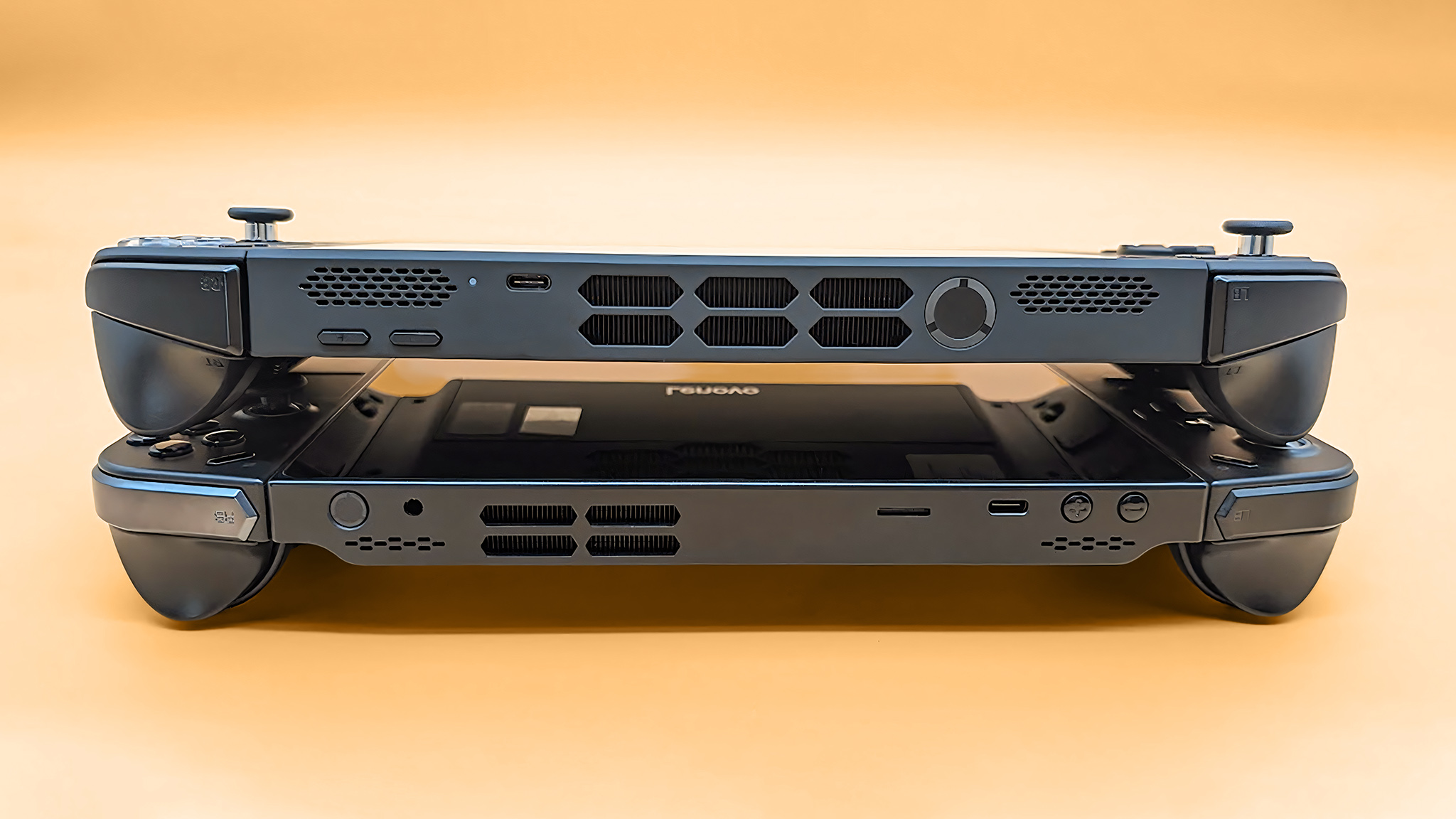 The Lenovo Legion Go 2 on the original Legion Go. The camera is angled so you can view the top of these devices. 