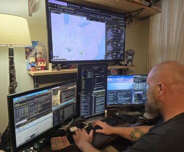 This is Danny. He works for my small company as a dispatcher. I thought his setup was rather cyberpunk, and thought you would like it too.