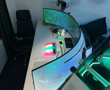 an open-air build with two ultrawide monitors
