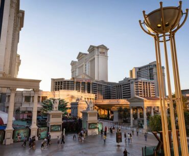 People walk around outside at Caesars Palace during Labor Day weekend on Sunday, Aug. 31, 2025, ...
