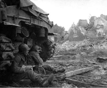 GI’s Sheltering Behind a Tank