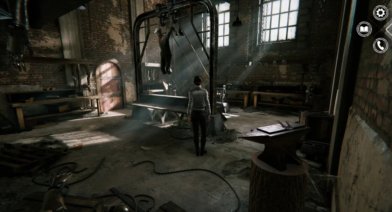 Oscar the automaton hangs from a factory machine in Syberia - Remastered. 