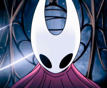 A screencap of Hollow Knight: Silksong's opening cutscene. A close-up shot of protagonist Hornet moments before she breaks out of a metal cage. Her curved white mask and red cloak are lit up as a glowing strand of silk surrounds her.