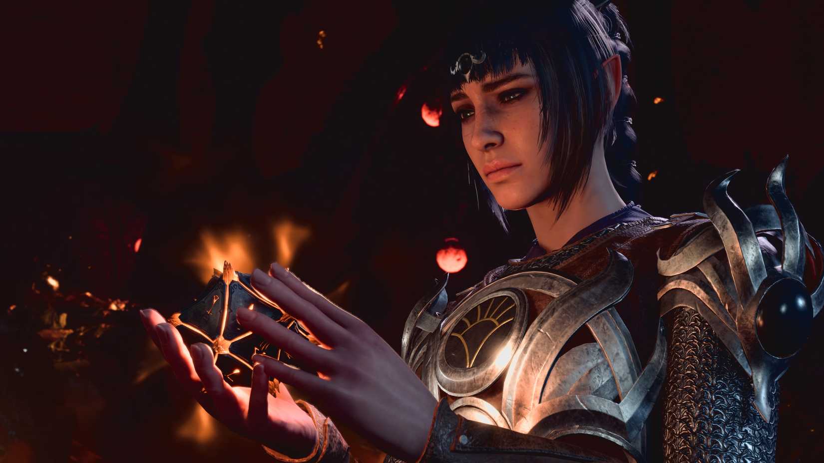 Shadowheart, a cleric, gazes at a magical device in her hands in Baldur’s Gate 3