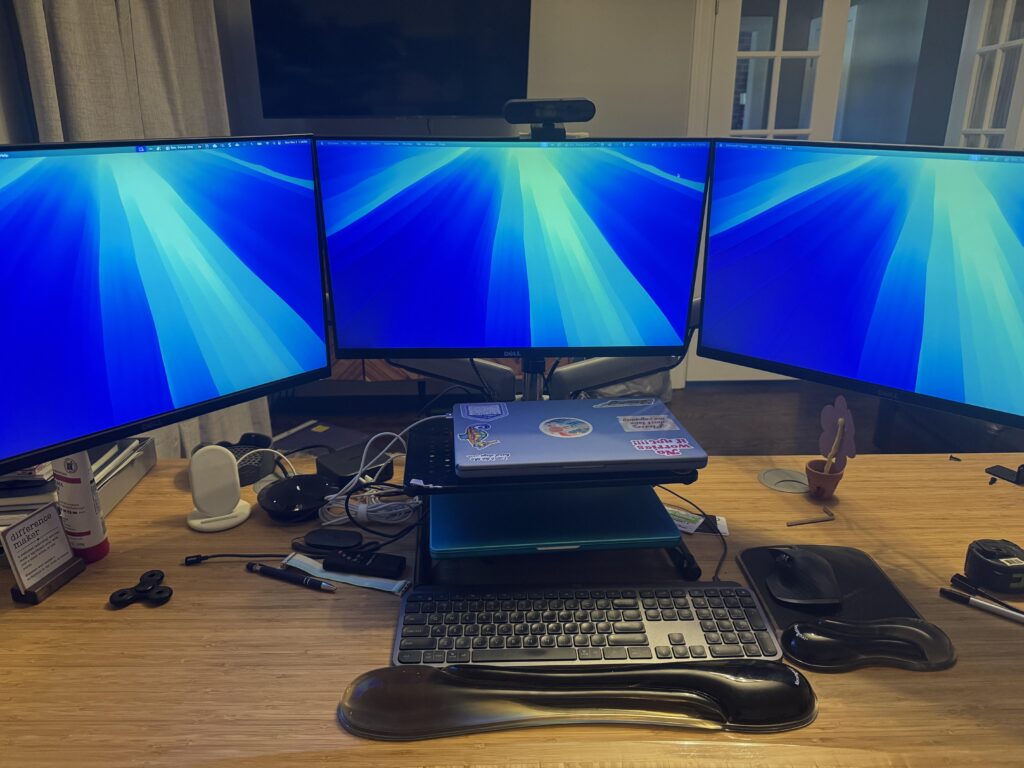 Help me optimize my dual-MacBook / triple-monitor setup