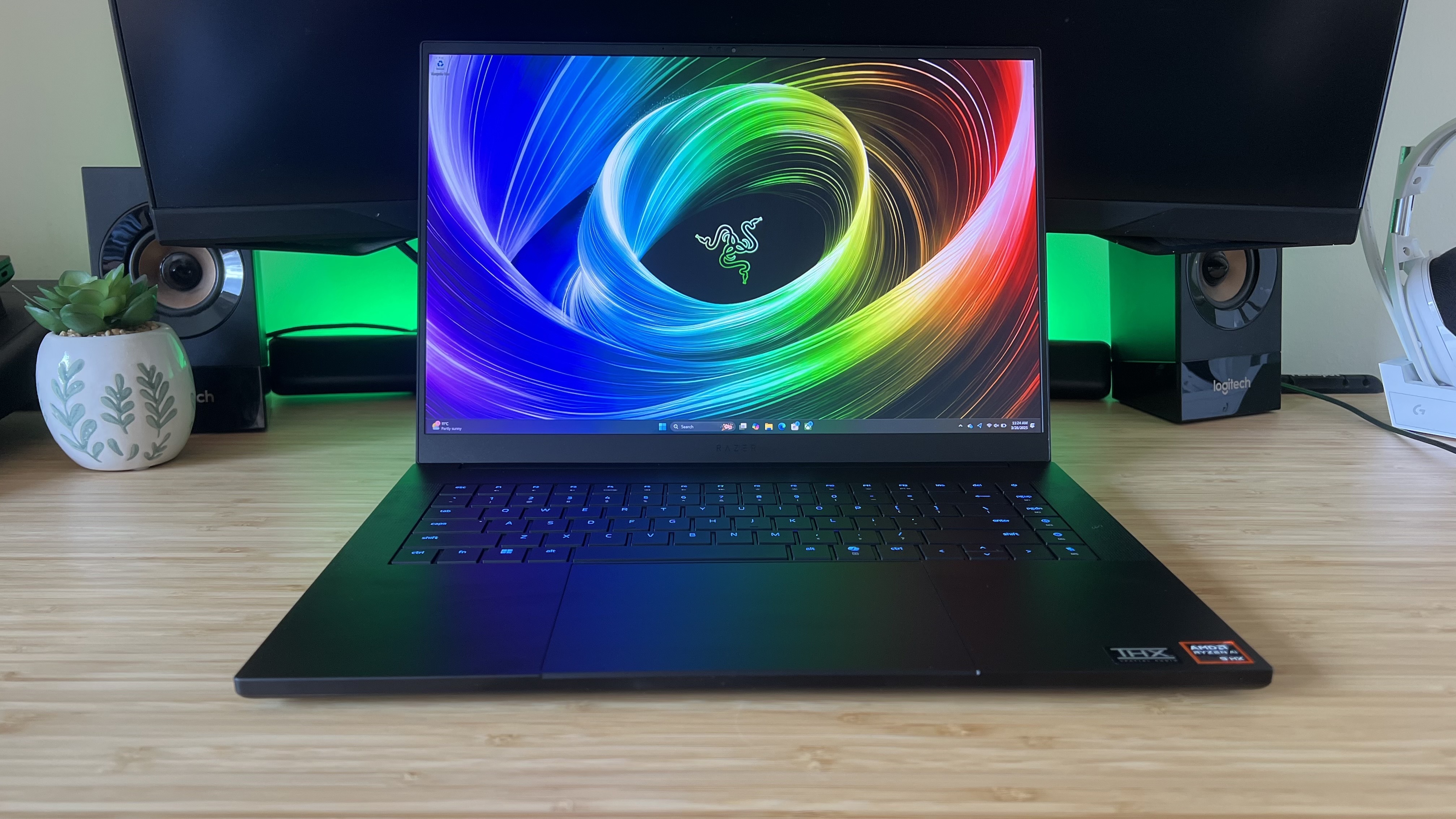 Razer Blade 16 2025 gaming laptop on a wooden desk