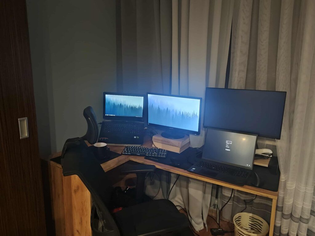 Need help arranging two setups (work + personal) on one corner desk. Any ergonomic tips?