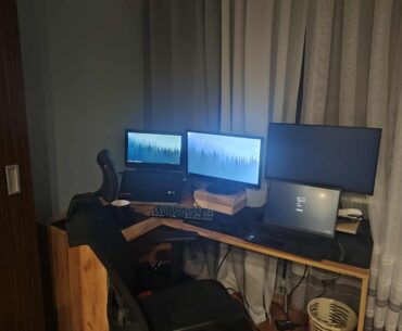 Need help arranging two setups (work + personal) on one corner desk. Any ergonomic tips?