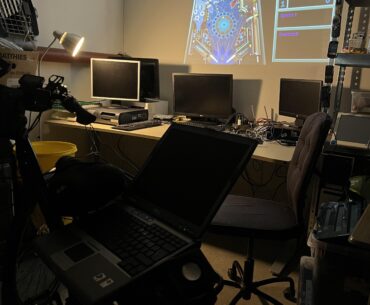 I call it the BikeRig. Windows XP-era Dell on a bike and a projector behind it.