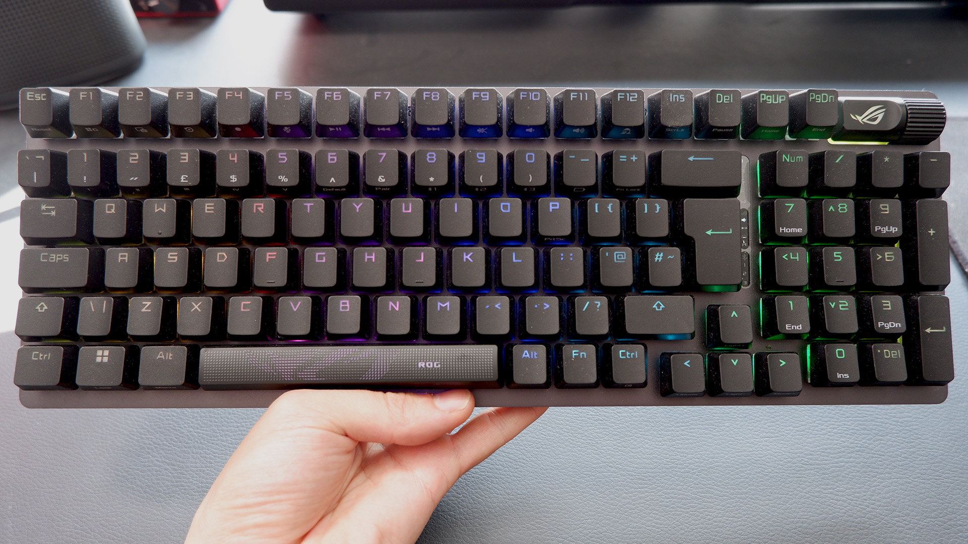 Asus ROG Strix Scope II 96 Wireless gaming keyboard on a desk.