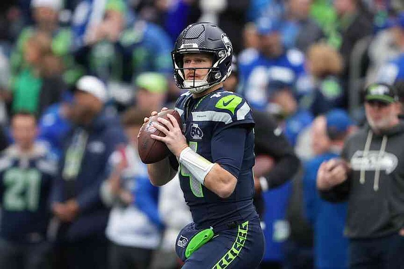 Seattle Seahawks quarterback Sam Darnold warms up before an NFL football game against the Indianapolis Colts, Sunday, Dec. 14, 2025, in Seattle. (AP Photo/Lindsey Wasson)