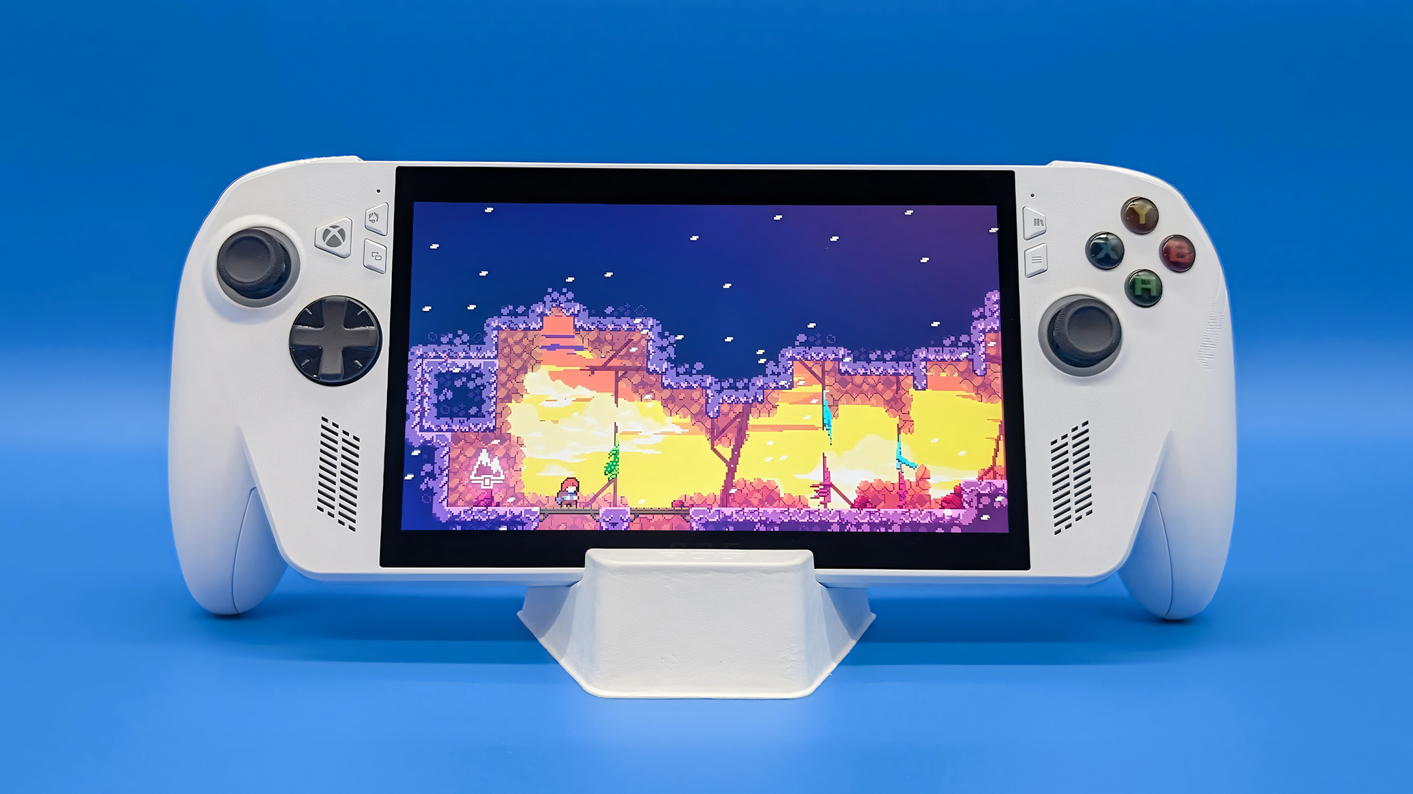 The Xbox Ally held up in its stand and playing Celeste.
