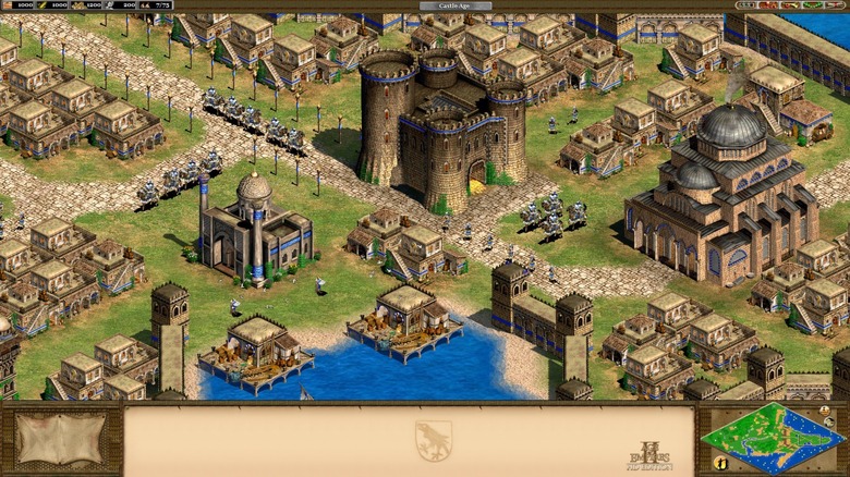 A medieval city bustles with activity around a castle in 