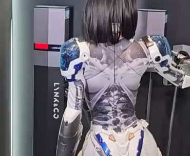 Yes, this is a real human inside a robotic suit, and it’s insanely realistic. She’s been blowing people’s minds at recent tech expos in China, and no matter how much I dig, I can’t find who the performer actually is. Anyone know?