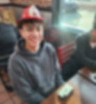 Juneau-Douglas High School: Yadaa.at Kalé senior Elias Dybdahl earned a kids' fire hat from the team for being selected Player of the Game in their win over Wasatch Academy at Las Vegas on Friday, Dec. 19, 2025. (Photo courtesy JDHS basketball)