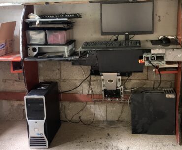 2009 basement workstation table is holding for dare life