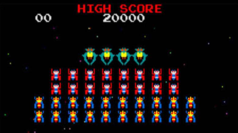 A line of incoming alien ships form ranks in 