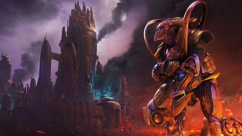 A Protoss warrior looks at a burning city in 