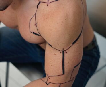 Cyberpunk inspired minimalistic cyberarm tattoo