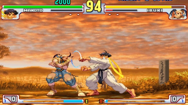 Ibuki and Makoto fight each other on a dirt road in 