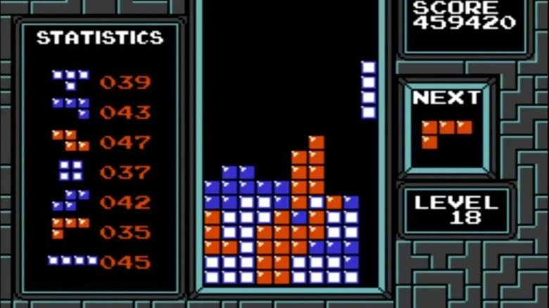 A long straight Tetris piece is on the far right side of a screen in 