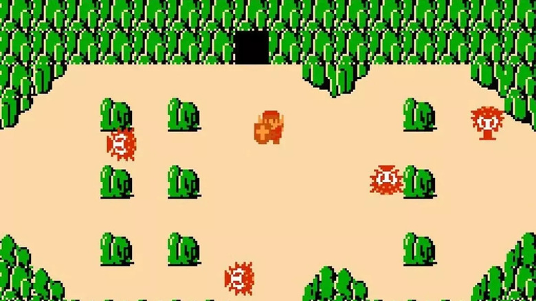 Link is surrounded by Octoroks among boulders in 