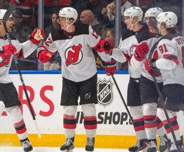 Glass has 3 points, Devils hold off Canucks